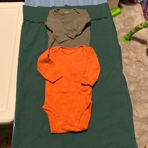 Orange and dark green long sleeve onesie